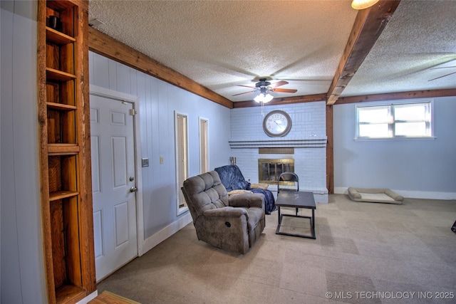 6508 W Cameron St, Sand Springs, OK 74127 - carpeted living area featuring baseboards, a fireplace, ceiling fan, a textured ceiling, and beamed ceiling