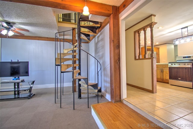 6508 W Cameron St, Sand Springs, OK 74127 - staircase with baseboards, tile patterned flooring, a textured ceiling, and ceiling fan
