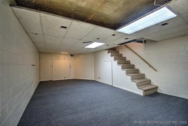 6508 W Cameron St, Sand Springs, OK 74127 - finished below grade area with dark colored carpet, visible vents, concrete block wall, and stairs
