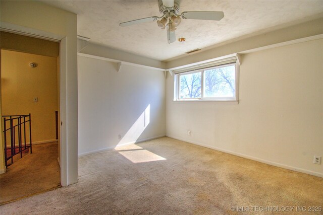 6508 W Cameron St, Sand Springs, OK 74127 - spare room with visible vents, baseboards, ceiling fan, and carpet flooring