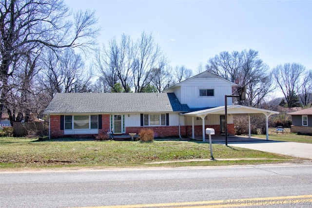 6508 W Cameron St, Sand Springs, OK 74127 - view of front facade with brick siding, an attached carport, a front lawn, fence, and driveway