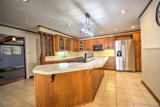 6508 W Cameron St, Sand Springs, OK 74127 - kitchen featuring brown cabinetry, light tile patterned flooring, light countertops, appliances with stainless steel finishes, and crown molding