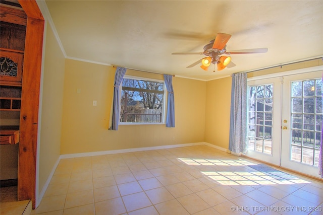 6508 W Cameron St, Sand Springs, OK 74127 - spare room featuring tile patterned flooring, baseboards, crown molding, and ceiling fan