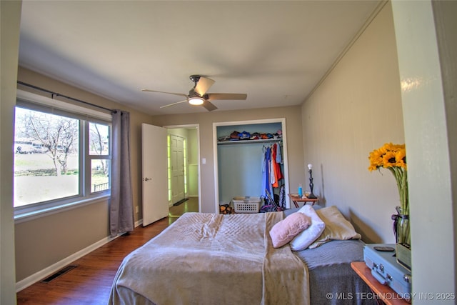 6508 W Cameron St, Sand Springs, OK 74127 - bedroom featuring visible vents, wood finished floors, a closet, baseboards, and ceiling fan