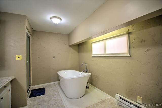 6508 W Cameron St, Sand Springs, OK 74127 - bathroom with a stall shower, a freestanding bath, baseboards, baseboard heating, and vanity