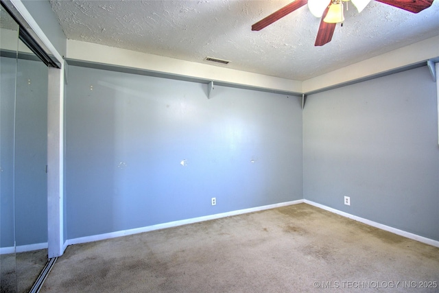 6508 W Cameron St, Sand Springs, OK 74127 - unfurnished room with a ceiling fan, baseboards, visible vents, carpet floors, and a textured ceiling
