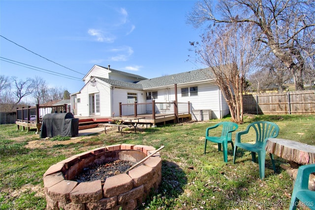 6508 W Cameron St, Sand Springs, OK 74127 - rear view of house featuring a wooden deck, a fire pit, a yard, and fence
