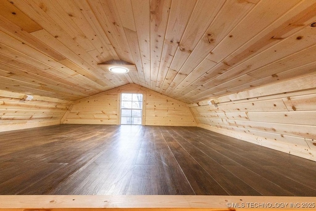 bonus room featuring wooden ceiling, dark wood-style flooring, wood walls, and vaulted ceiling
