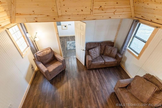 living room with dark wood-type flooring and baseboards
