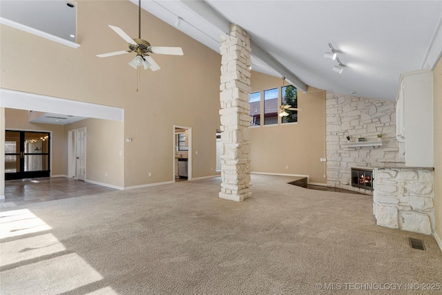 6505 S Oswego Ave, Tulsa, OK 74136 - unfurnished living room featuring visible vents, a ceiling fan, carpet, and decorative columns