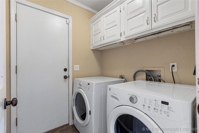 6505 S Oswego Ave, Tulsa, OK 74136 - washroom featuring ornamental molding, independent washer and dryer, and cabinet space