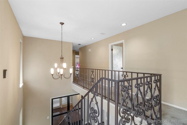 6505 S Oswego Ave, Tulsa, OK 74136 - stairway featuring baseboards, carpet floors, and an inviting chandelier