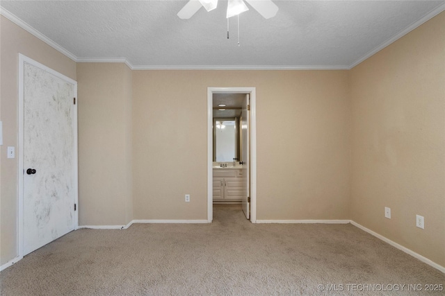 6505 S Oswego Ave, Tulsa, OK 74136 - unfurnished bedroom with connected bathroom, crown molding, carpet, and a textured ceiling