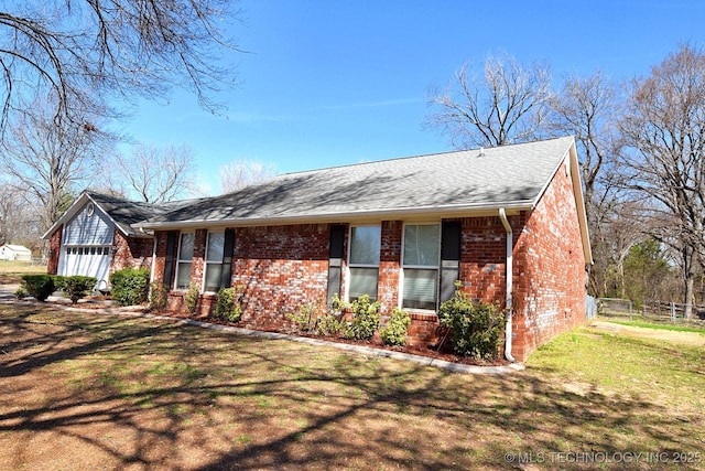 1430 Williams St, Fort Gibson, OK 74434 - single story home with fence, a front yard, a shingled roof, a garage, and brick siding
