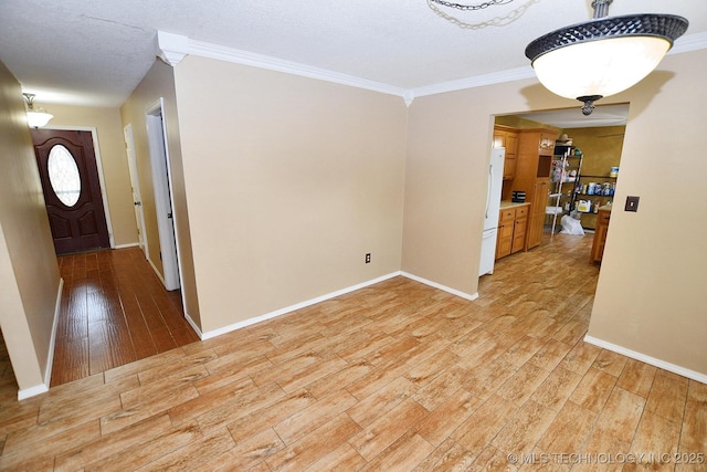 1430 Williams St, Fort Gibson, OK 74434 - unfurnished dining area with light wood-type flooring, baseboards, and crown molding