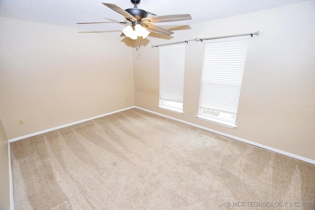 1430 Williams St, Fort Gibson, OK 74434 - carpeted empty room featuring baseboards and a ceiling fan