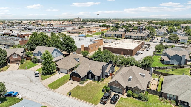 birds eye view of property with a residential view