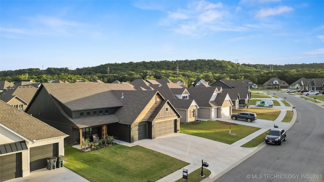 birds eye view of property with a residential view