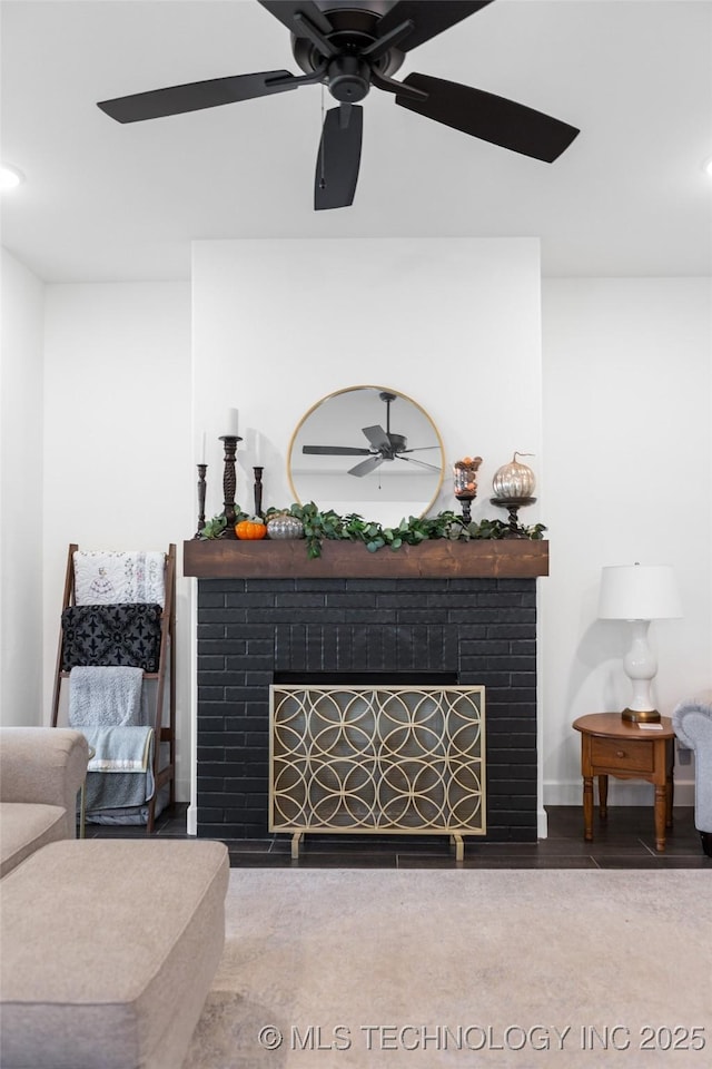 living area featuring recessed lighting, a ceiling fan, and a fireplace