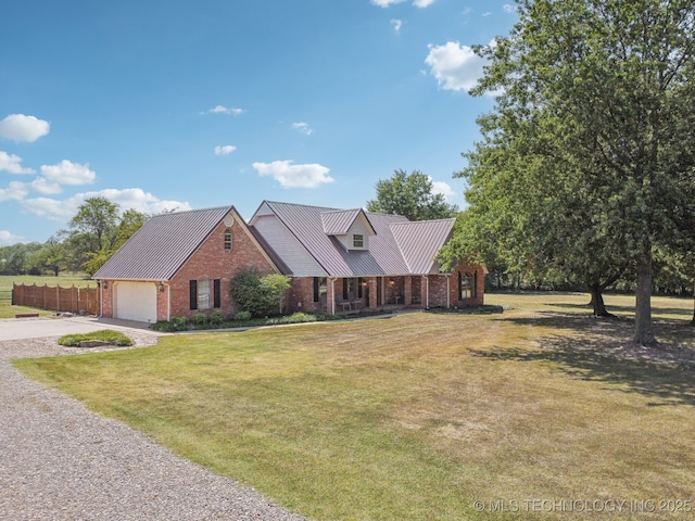 11712 E 121st St, Collinsville, OK 74021 - view of front facade with concrete driveway, brick siding, metal roof, a porch, and a standing seam roof