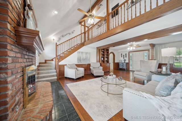 11712 E 121st St, Collinsville, OK 74021 - living room with ceiling fan, stairs, a brick fireplace, arched walkways, and recessed lighting