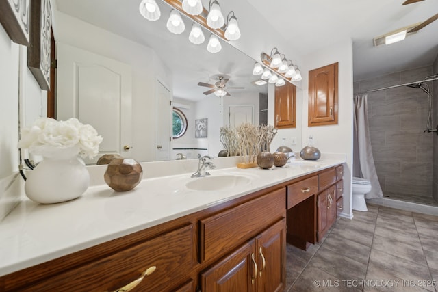 11712 E 121st St, Collinsville, OK 74021 - full bathroom featuring ceiling fan, tiled shower, vanity, and toilet