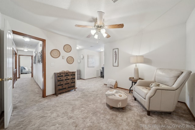 11712 E 121st St, Collinsville, OK 74021 - living area featuring carpet floors, ceiling fan, and baseboards