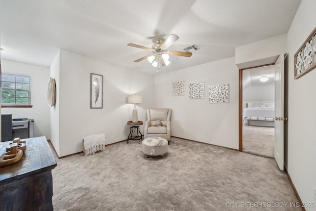 11712 E 121st St, Collinsville, OK 74021 - living area featuring ceiling fan, carpet floors, and baseboards