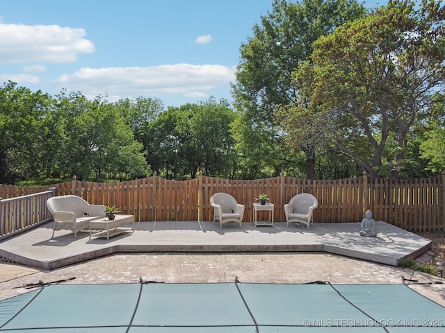 11712 E 121st St, Collinsville, OK 74021 - view of patio with a wooden deck and a fenced backyard