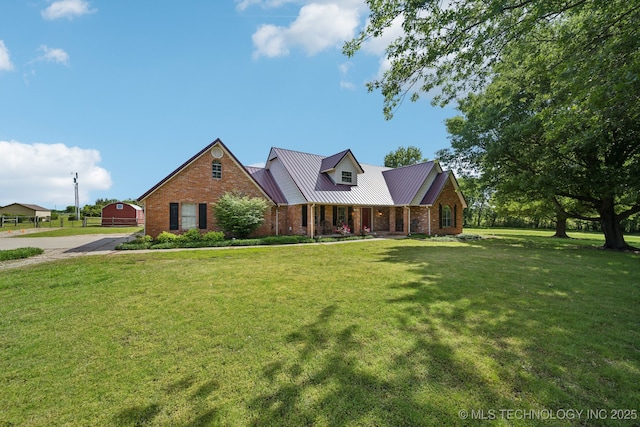 11712 E 121st St, Collinsville, OK 74021 - view of front of property with covered porch, brick siding, a front yard, and metal roof