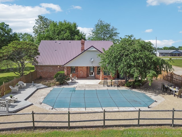 11712 E 121st St, Collinsville, OK 74021 - view of pool with a fenced backyard and a patio