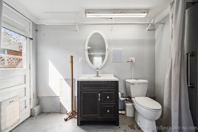 bathroom featuring toilet, unfinished concrete floors, and vanity