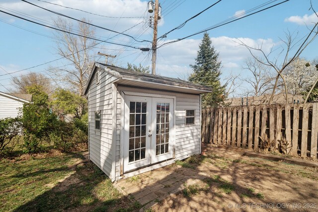 view of shed with a fenced backyard