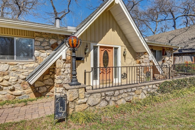 entrance to property with stone siding