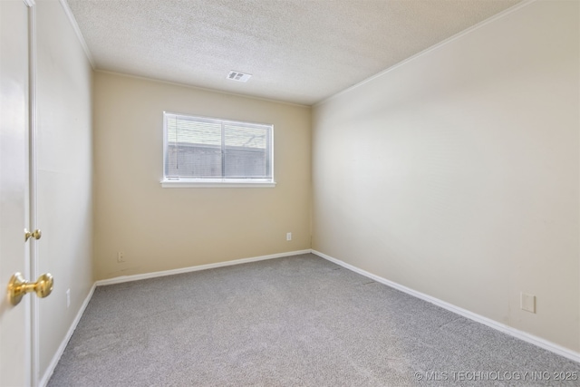 empty room with visible vents, crown molding, baseboards, carpet floors, and a textured ceiling