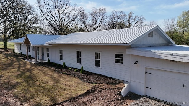 17022 S 579th Rd, Tahlequah, OK 74464 - view of property exterior with a metal roof and a garage