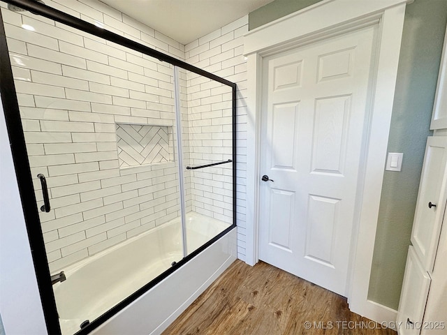17022 S 579th Rd, Tahlequah, OK 74464 - bathroom featuring wood finished floors and enclosed tub / shower combo