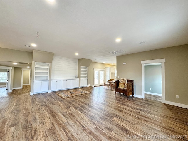 17022 S 579th Rd, Tahlequah, OK 74464 - unfurnished living room with wood finished floors and recessed lighting