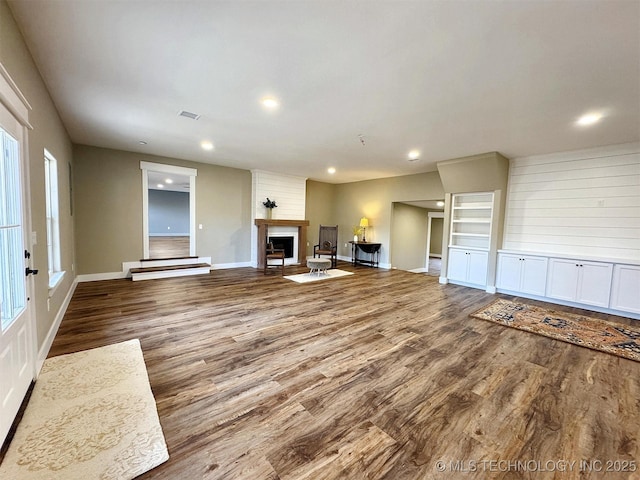 17022 S 579th Rd, Tahlequah, OK 74464 - unfurnished living room featuring wood finished floors, recessed lighting, and a large fireplace
