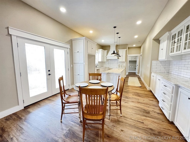 17022 S 579th Rd, Tahlequah, OK 74464 - dining area featuring healthy amount of natural light, light wood-style floors, french doors, and recessed lighting