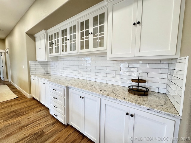 17022 S 579th Rd, Tahlequah, OK 74464 - kitchen with white cabinets, wood finished floors, and glass insert cabinets