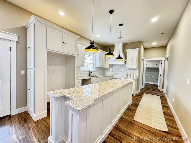 17022 S 579th Rd, Tahlequah, OK 74464 - kitchen featuring dark wood-type flooring, backsplash, stainless steel dishwasher, white cabinets, and recessed lighting