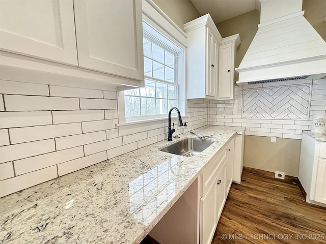 17022 S 579th Rd, Tahlequah, OK 74464 - kitchen with premium range hood, tasteful backsplash, light stone counters, white cabinets, and dark wood-style floors