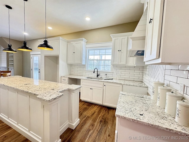 17022 S 579th Rd, Tahlequah, OK 74464 - kitchen featuring dark wood-style flooring, white cabinets, a kitchen island, light stone countertops, and recessed lighting