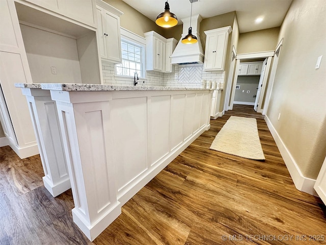 17022 S 579th Rd, Tahlequah, OK 74464 - kitchen featuring dark wood-style flooring, white cabinetry, decorative backsplash, and light stone countertops