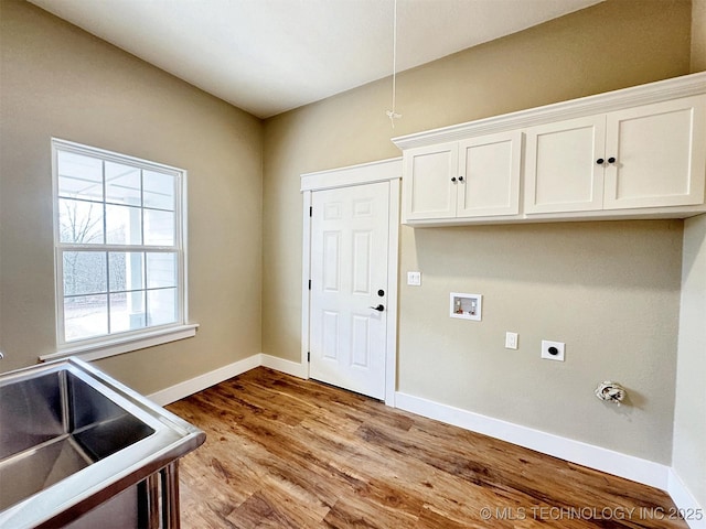 17022 S 579th Rd, Tahlequah, OK 74464 - washroom with cabinet space, electric dryer hookup, hookup for a washing machine, and wood finished floors