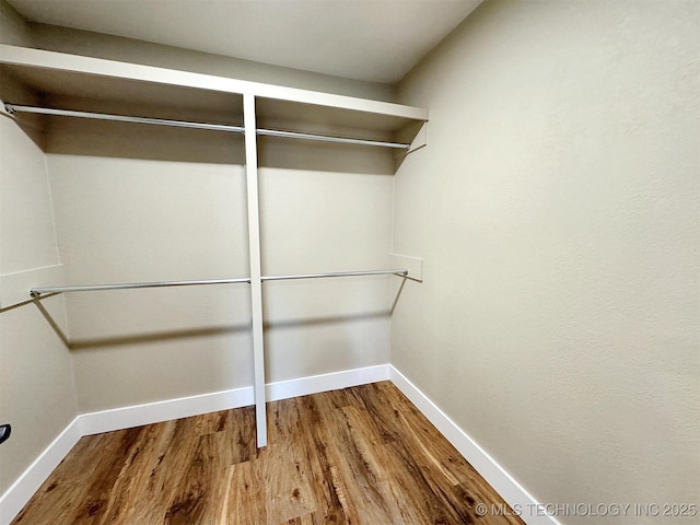 17022 S 579th Rd, Tahlequah, OK 74464 - walk in closet featuring wood finished floors