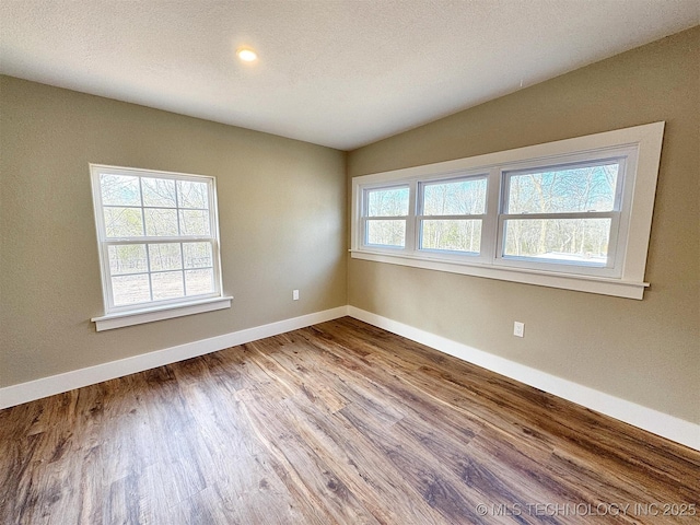 17022 S 579th Rd, Tahlequah, OK 74464 - spare room with baseboards and wood finished floors