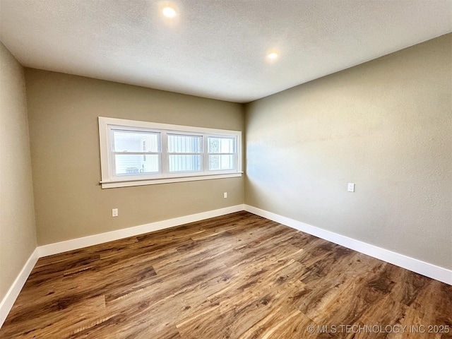 17022 S 579th Rd, Tahlequah, OK 74464 - spare room with wood finished floors, recessed lighting, and a textured ceiling