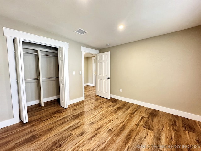 17022 S 579th Rd, Tahlequah, OK 74464 - unfurnished bedroom with wood finished floors and a closet